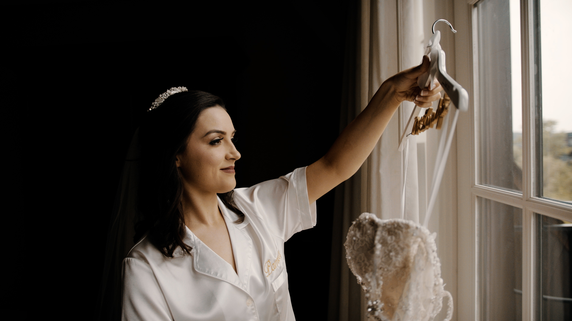 Bride Looking at her Dress at a Royal Park Hotel Wedding